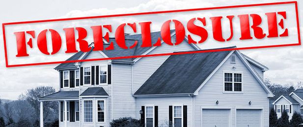 A house with the word foreclosure written on it.